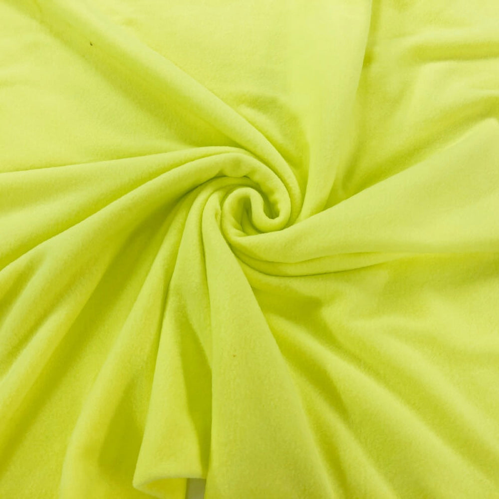 Close-up of bright yellow fabric with a swirl pattern
