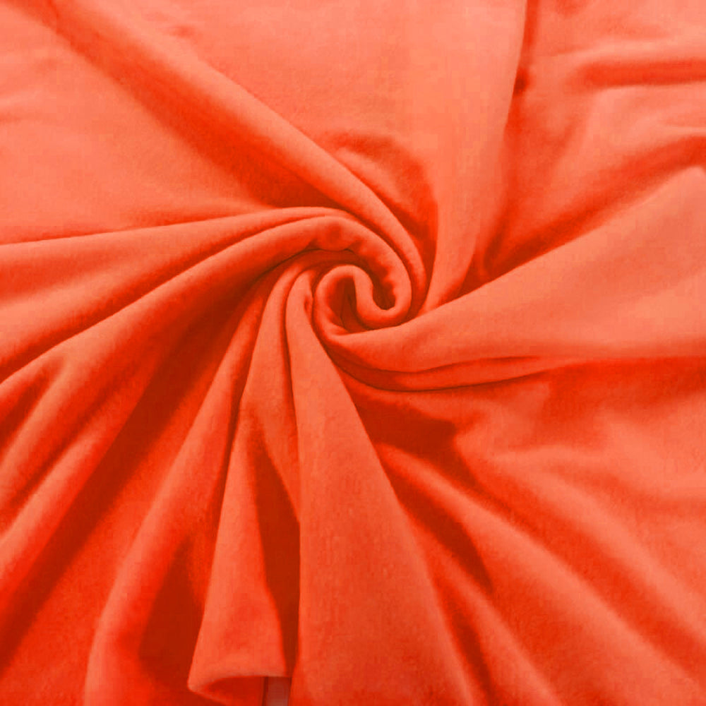 Close-up of orange fabric with a swirl pattern
